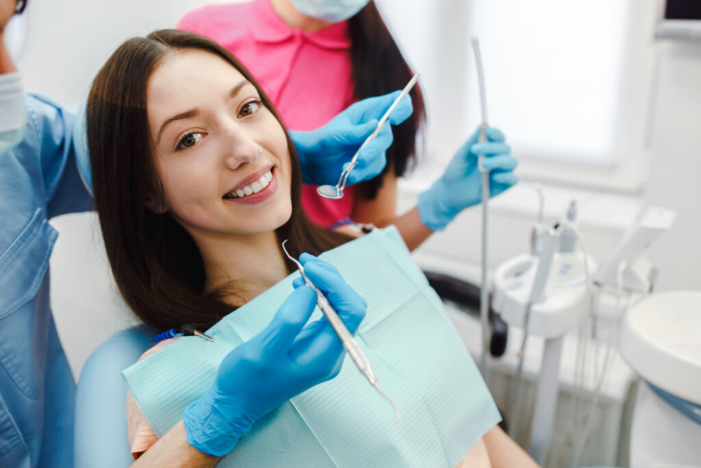 A woman is holding a blue and white object