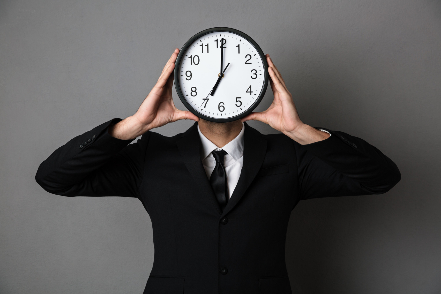 A man with a clock on his head